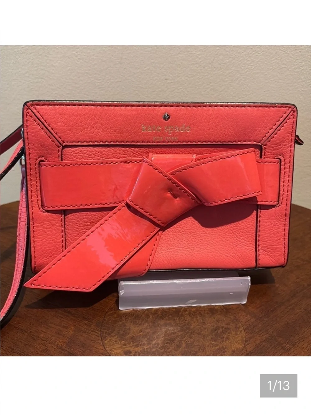 Kate Spade wristlet  pebble leather/patent bow on front  orangeish red gold NWOT